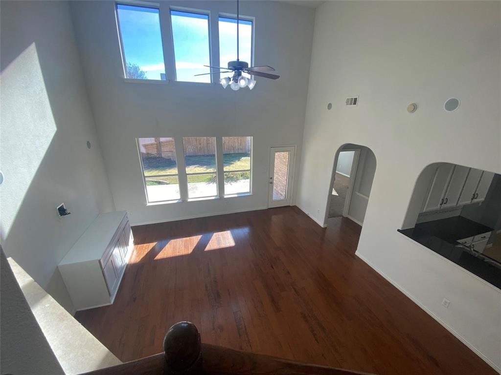 612 Catalpa Road Fort Worth, TX 76131 - Photo 8 of 26 a living room with furniture and a large window