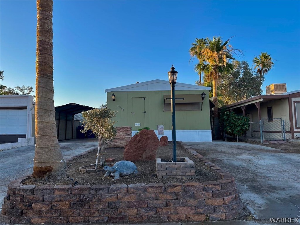 1395 Lause Road Bullhead City, AZ 86442 - Photo 1 of 34 Front of home featuring two driveways