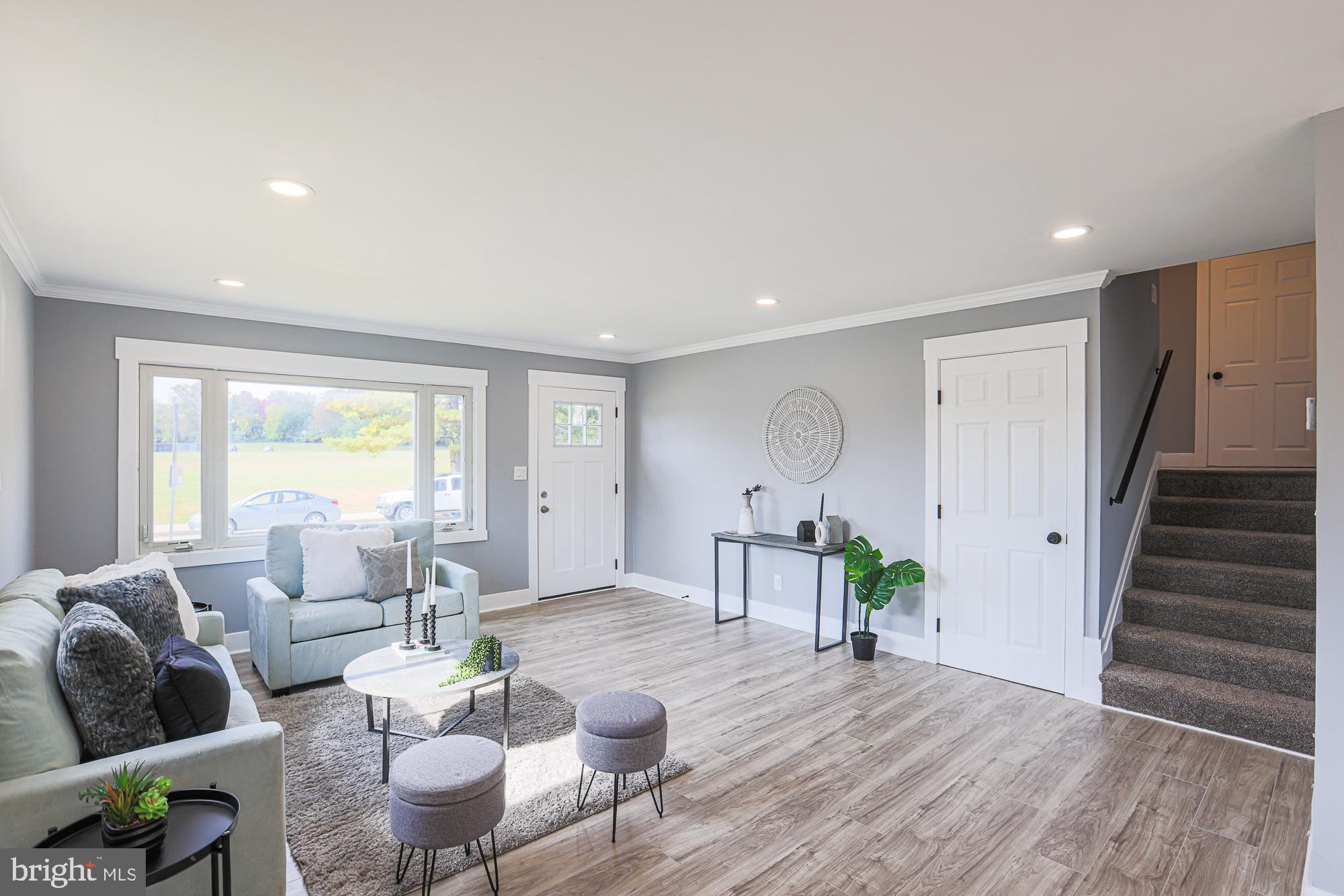 3715 Washington Avenue Baltimore, MD 21244 - Photo 12 of 57 a living room with furniture and a wooden floor
