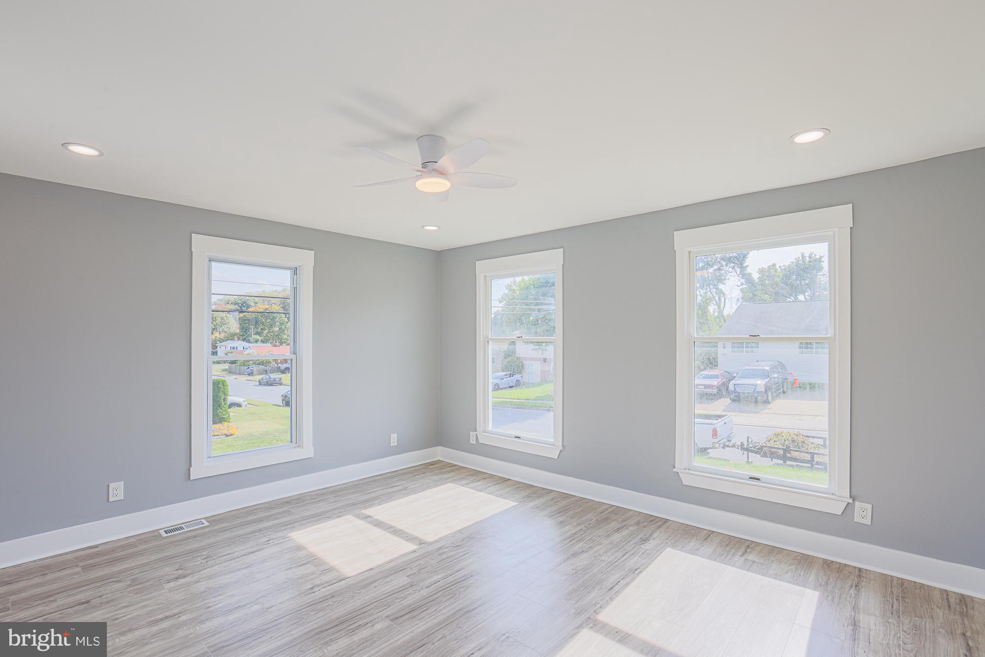 3715 Washington Avenue Baltimore, MD 21244 - Photo 37 of 57 a view of an empty room with wooden floor and a window