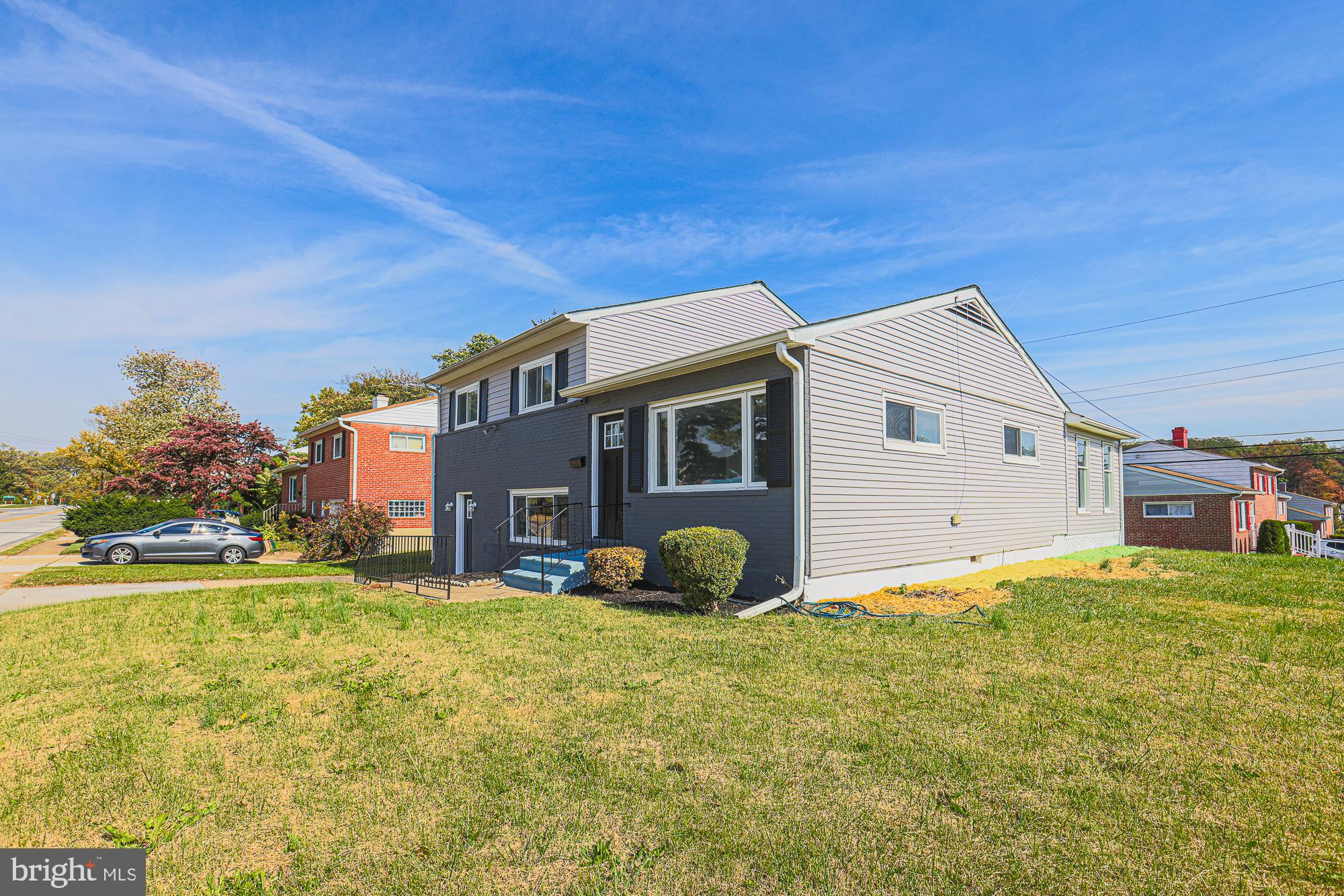 3715 Washington Avenue Baltimore, MD 21244 - Photo 4 of 57 a front view of a house with a garden