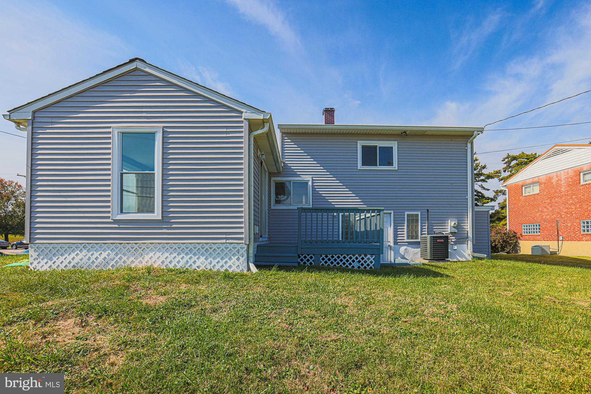 3715 Washington Avenue Baltimore, MD 21244 - Photo 52 of 57 a front view of a house with a yard