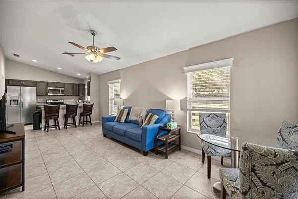 a living room with furniture and a window