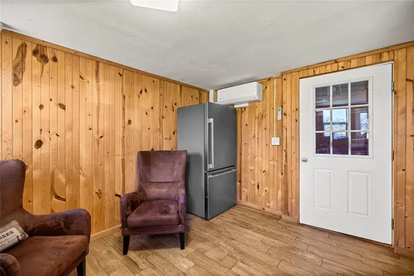 a living room with furniture and a shower