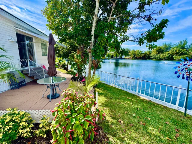 a view of a backyard with sitting area