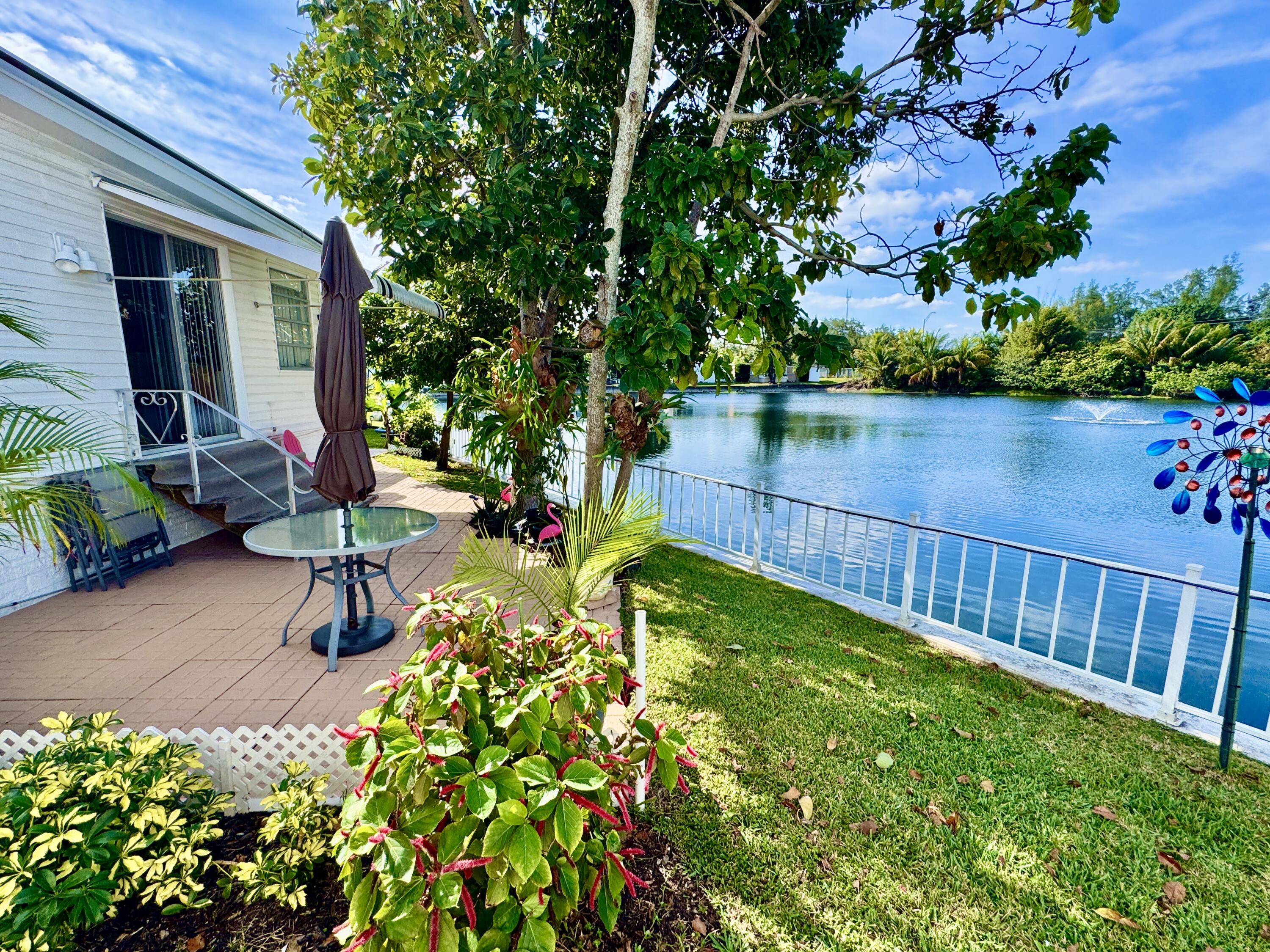 a view of a backyard with sitting area