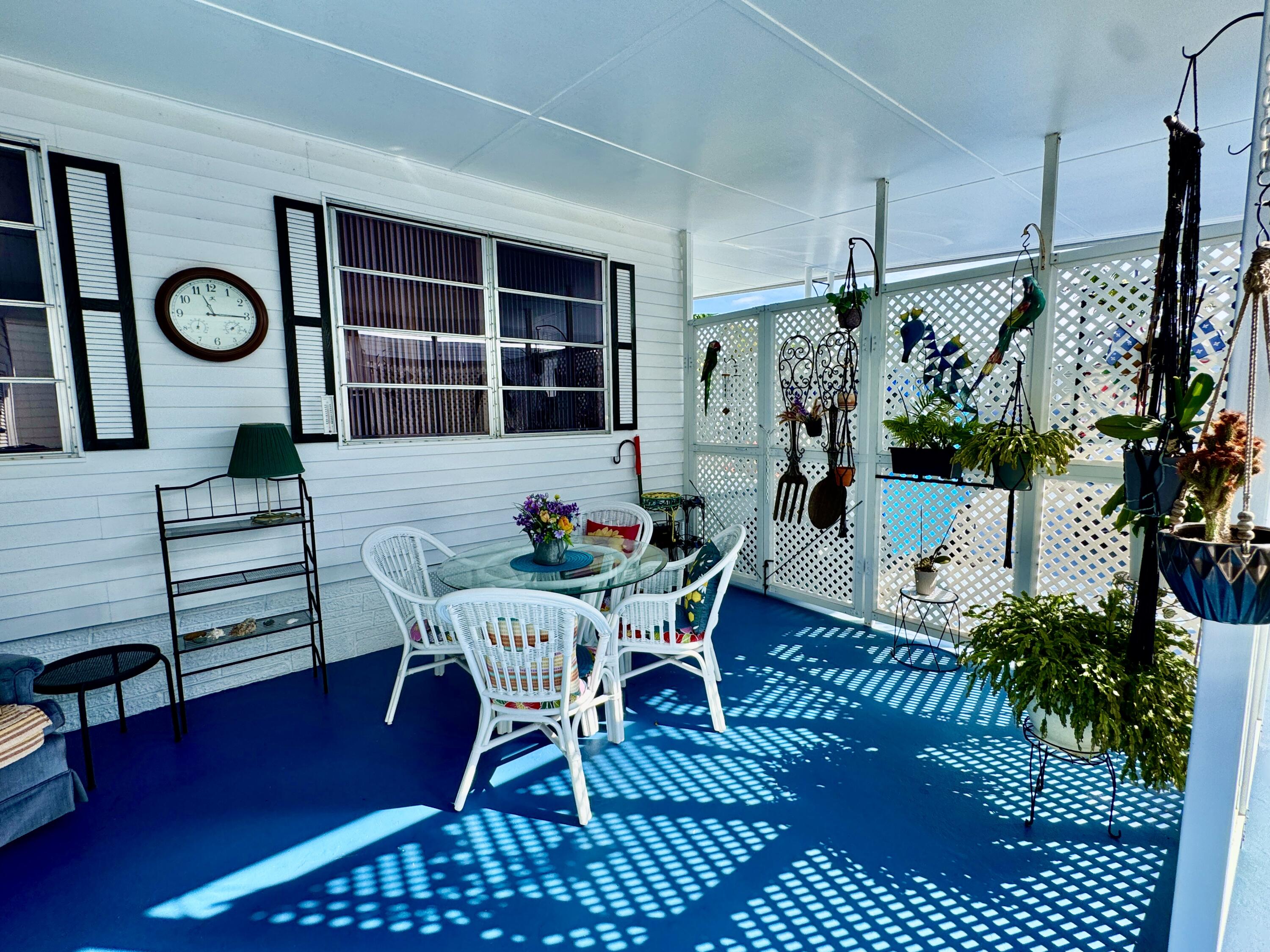 1324 South 33rd Road, Unit 1324 Hollywood, FL 33021 - Photo 12 of 23 a view of a dining room with furniture and a potted plant
