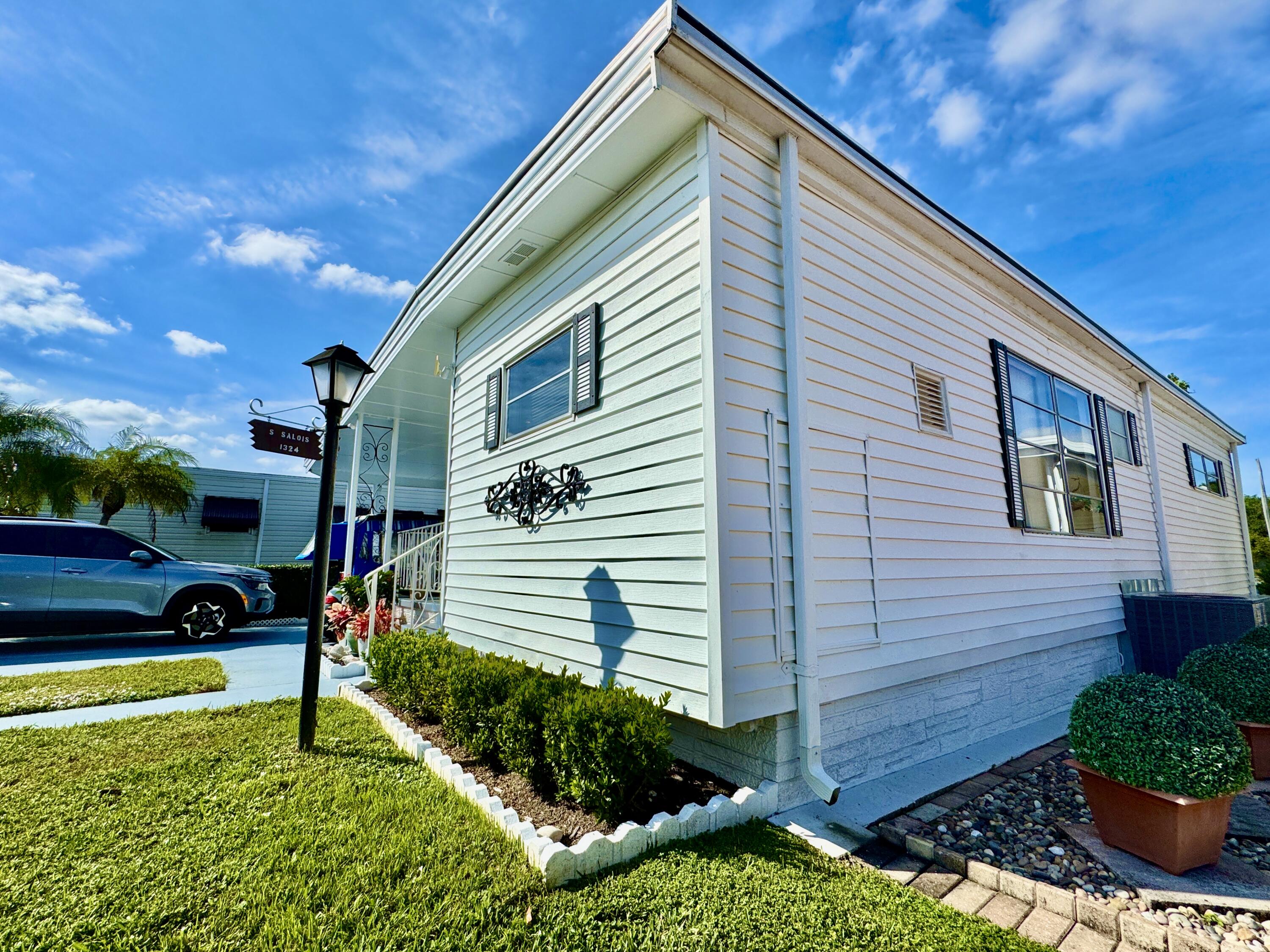 1324 South 33rd Road, Unit 1324 Hollywood, FL 33021 - Photo 15 of 23 a backyard of a house with plants and tree