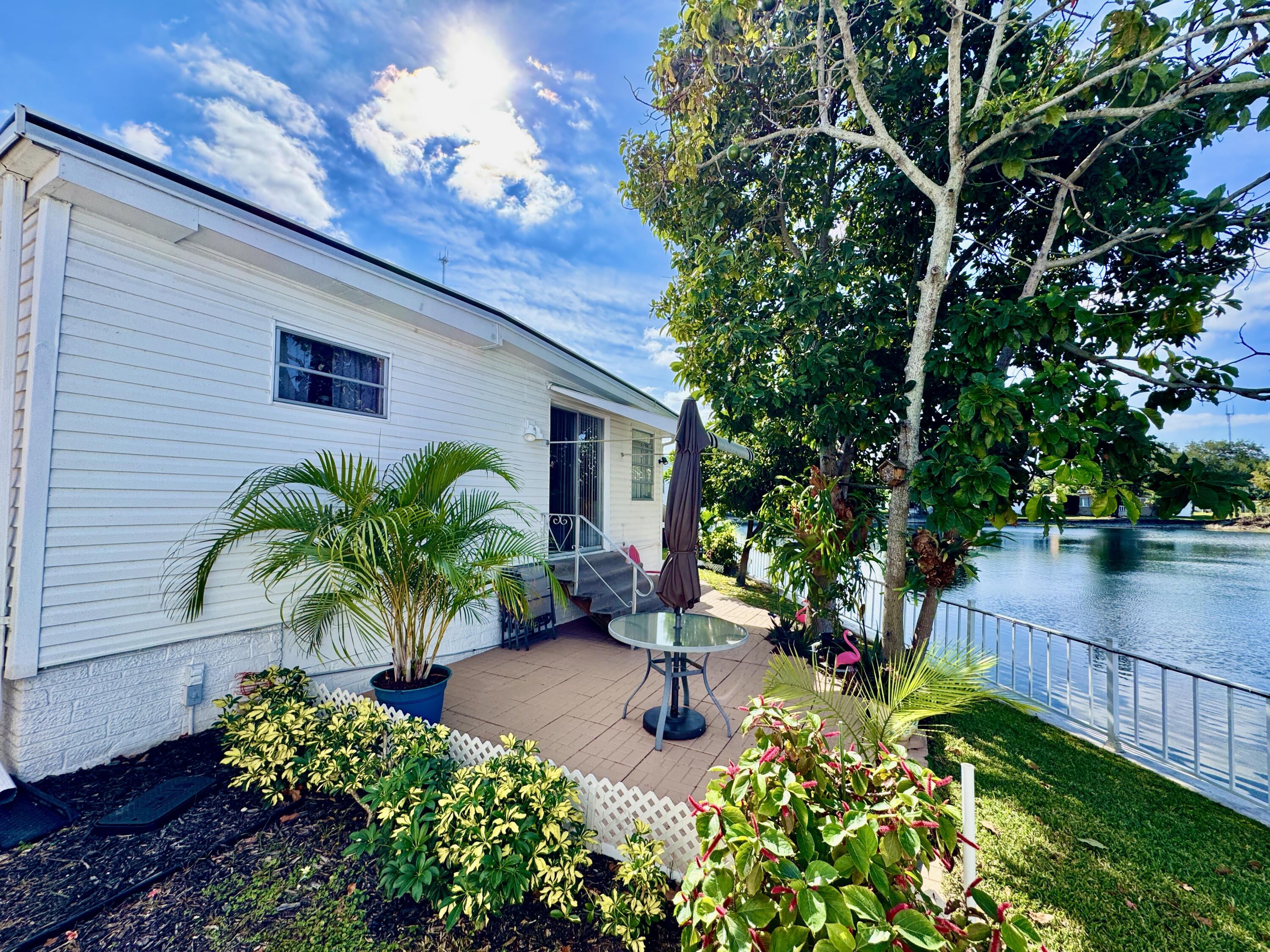 1324 South 33rd Road, Unit 1324 Hollywood, FL 33021 - Photo 17 of 23 a house with garden in front of it