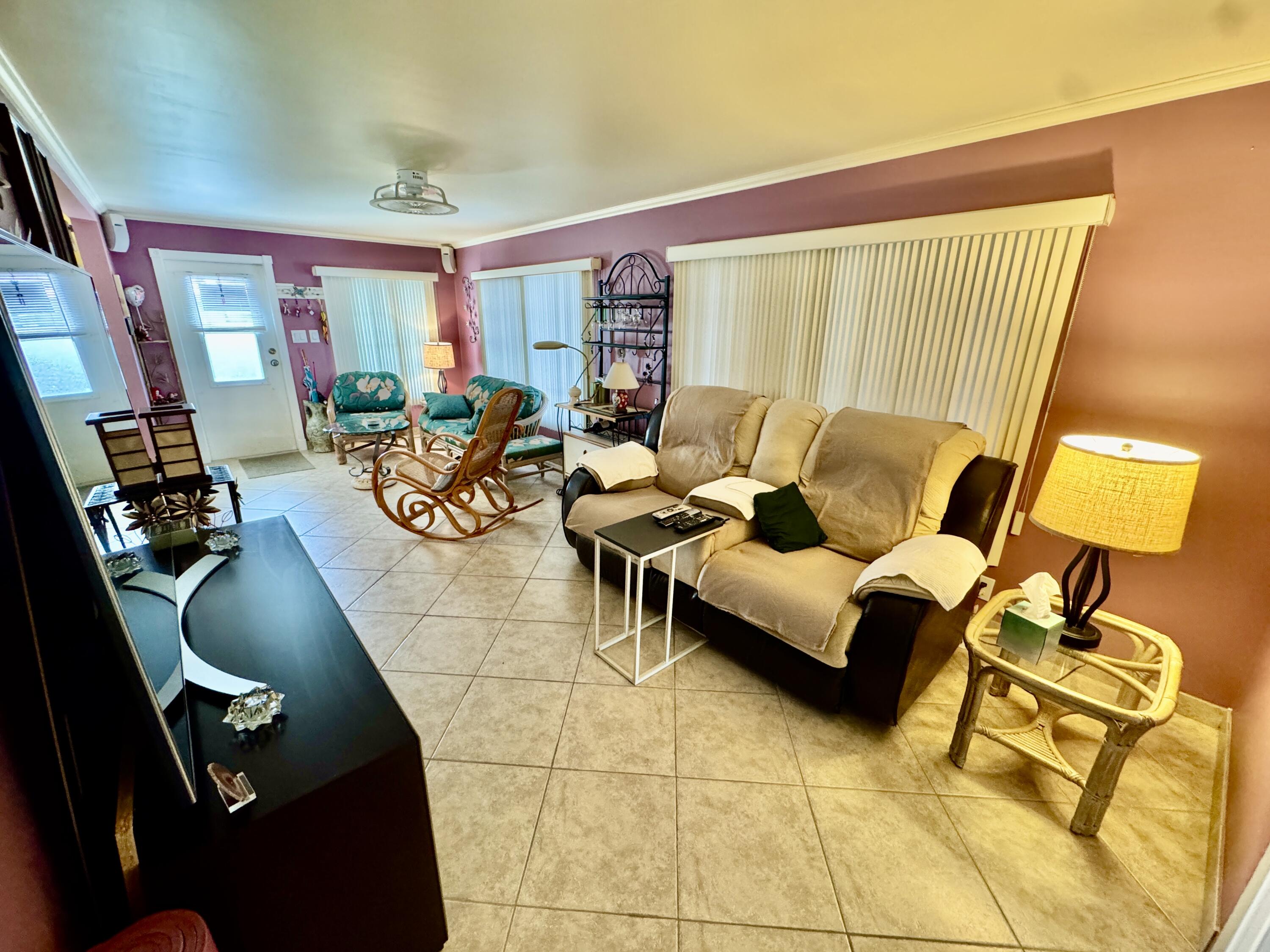 1324 South 33rd Road, Unit 1324 Hollywood, FL 33021 - Photo 4 of 23 a living room with furniture and a window