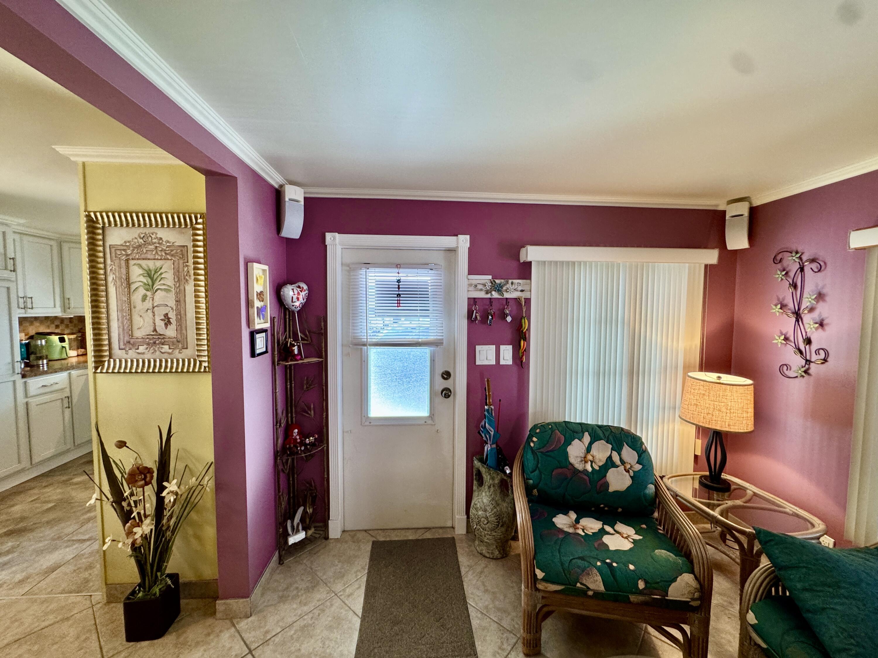 1324 South 33rd Road, Unit 1324 Hollywood, FL 33021 - Photo 6 of 23 a bedroom with furniture and a lamp