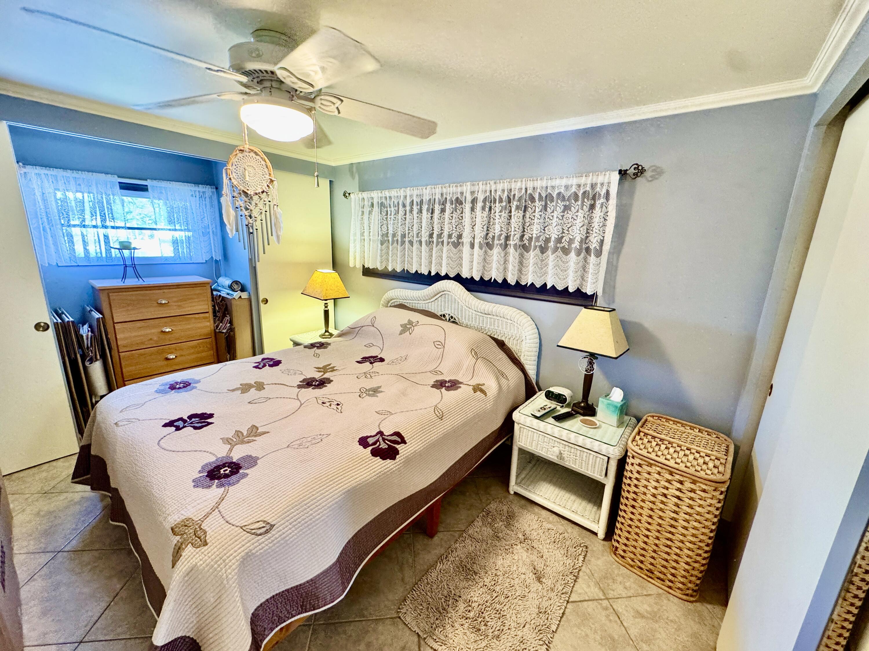 1324 South 33rd Road, Unit 1324 Hollywood, FL 33021 - Photo 7 of 23 a bed sitting in a bedroom next to a window