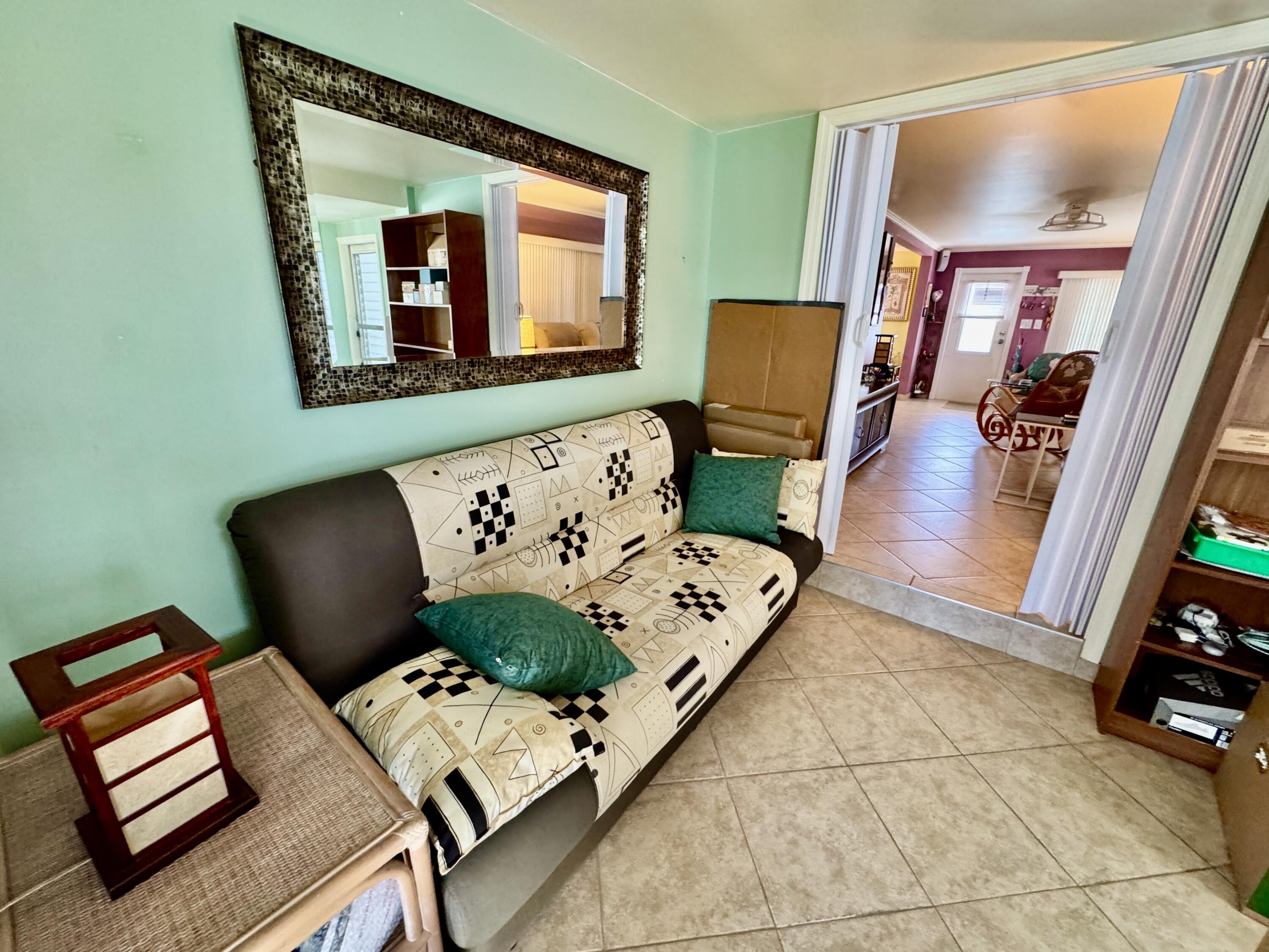 1324 South 33rd Road, Unit 1324 Hollywood, FL 33021 - Photo 9 of 23 a living room with furniture and a flat screen tv