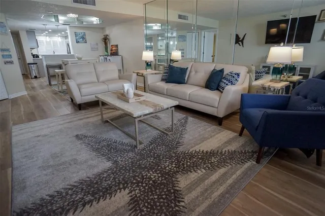 a kitchen with a sink stainless steel appliances and cabinets