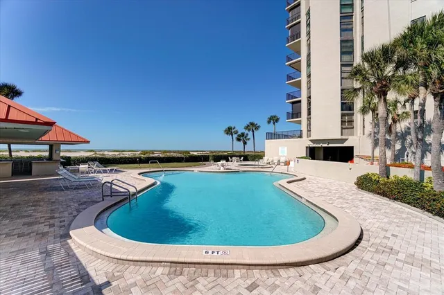 an aerial view of a pool patio fire pit and outdoor seating