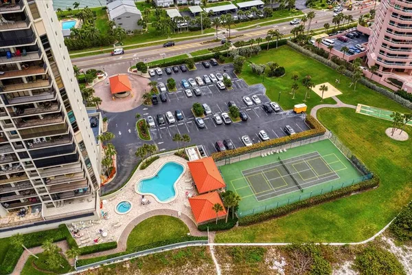 a living room with furniture a large window and a flat screen tv