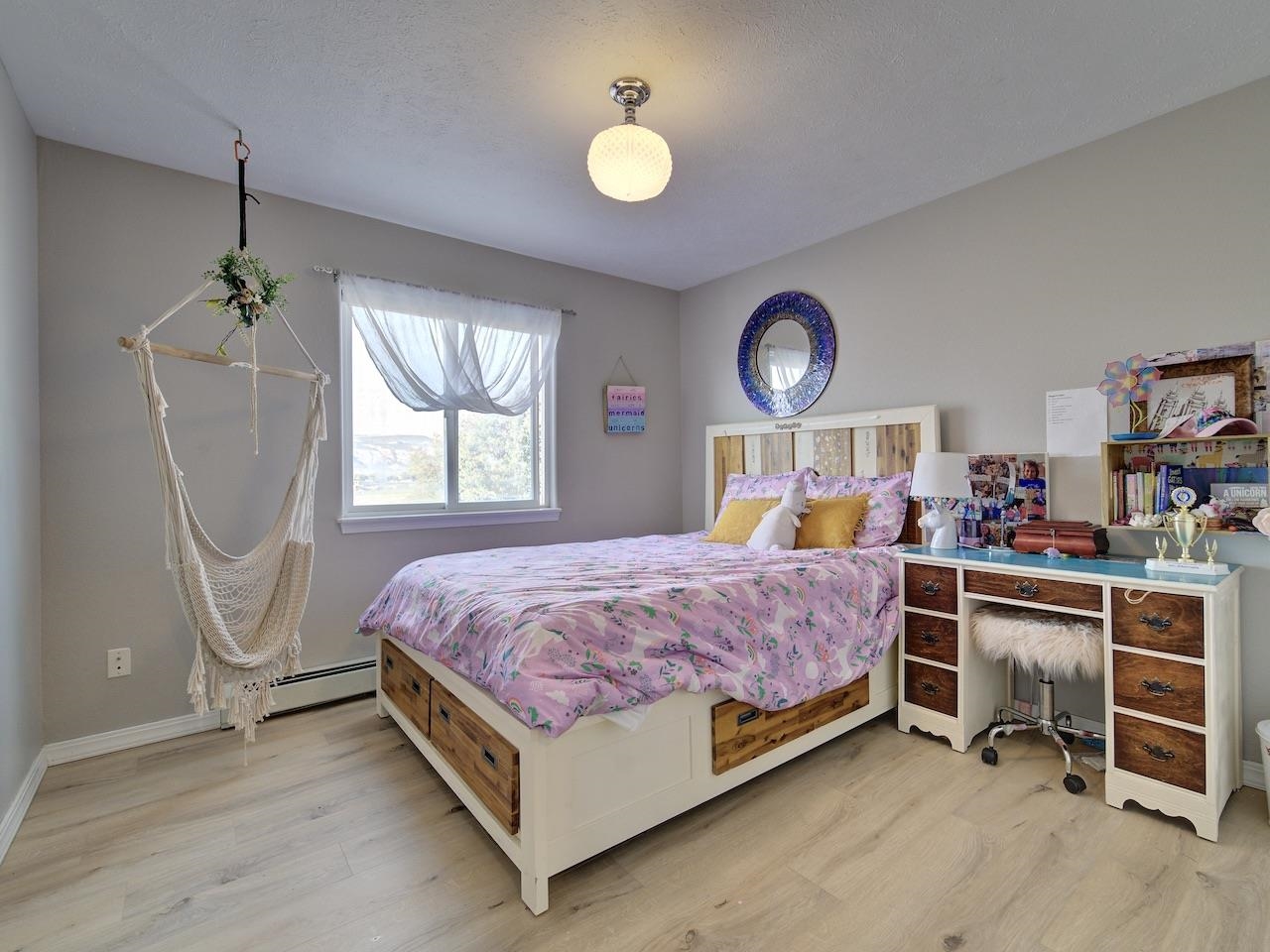 970 20 Road Fruita, CO 81521 - Photo 15 of 31 a bed room with a bed and a chandelier