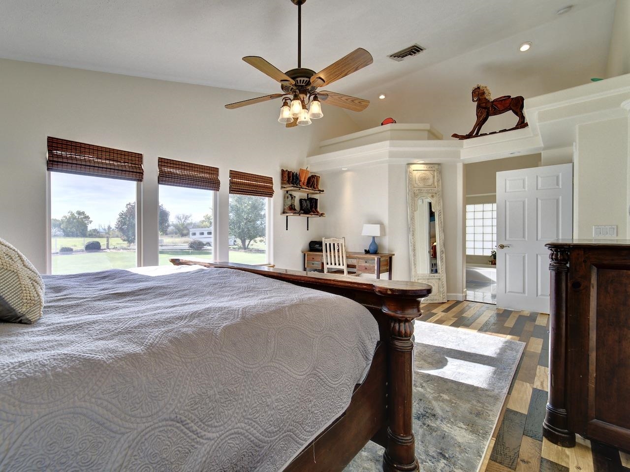 970 20 Road Fruita, CO 81521 - Photo 19 of 31 a bedroom with a bed a window and a flat screen tv
