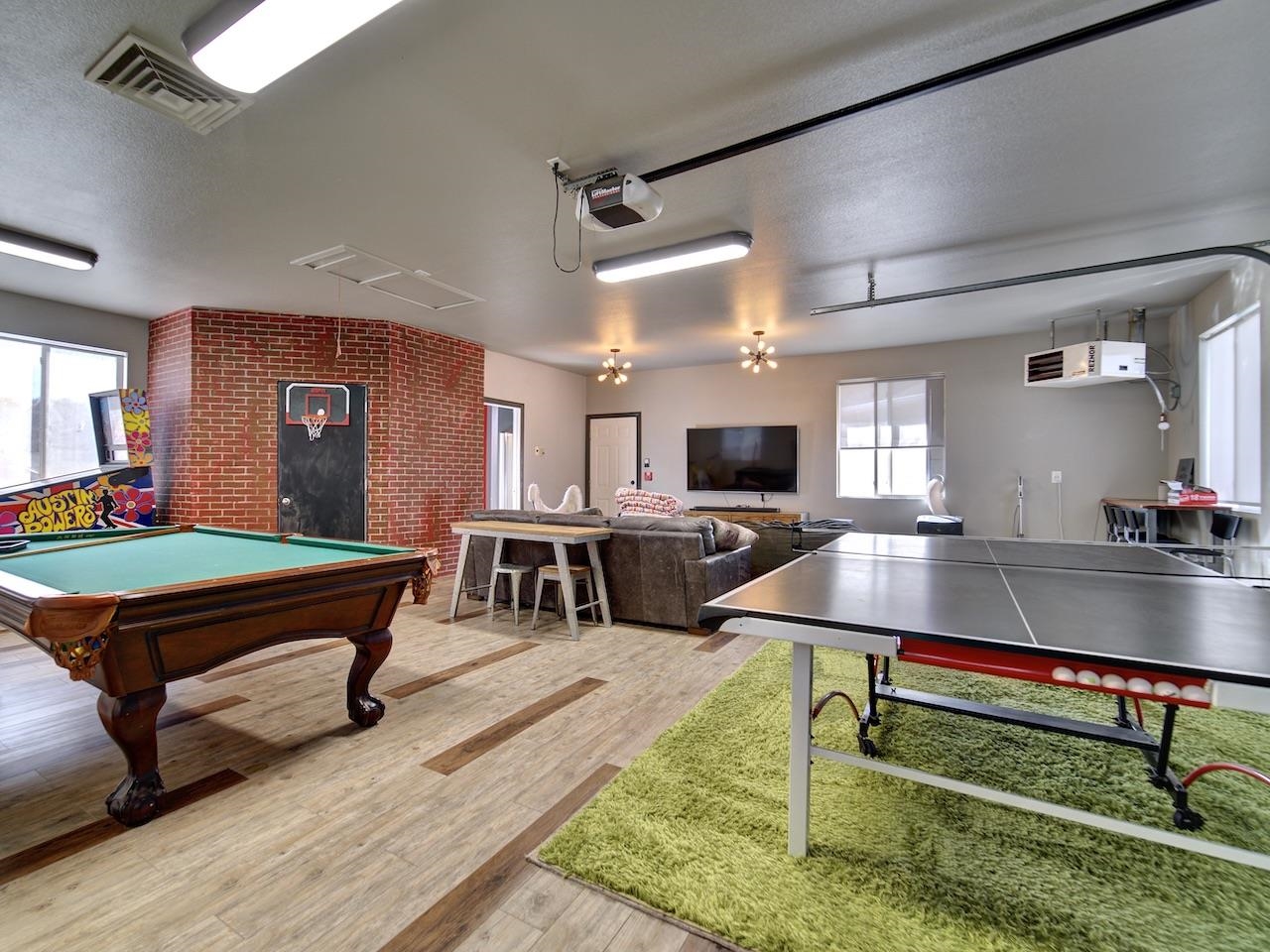 970 20 Road Fruita, CO 81521 - Photo 25 of 31 a living room with furniture pool table and flat screen tv