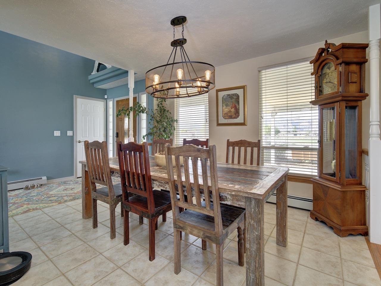 970 20 Road Fruita, CO 81521 - Photo 3 of 31 a view of a dining room with furniture and chandelier