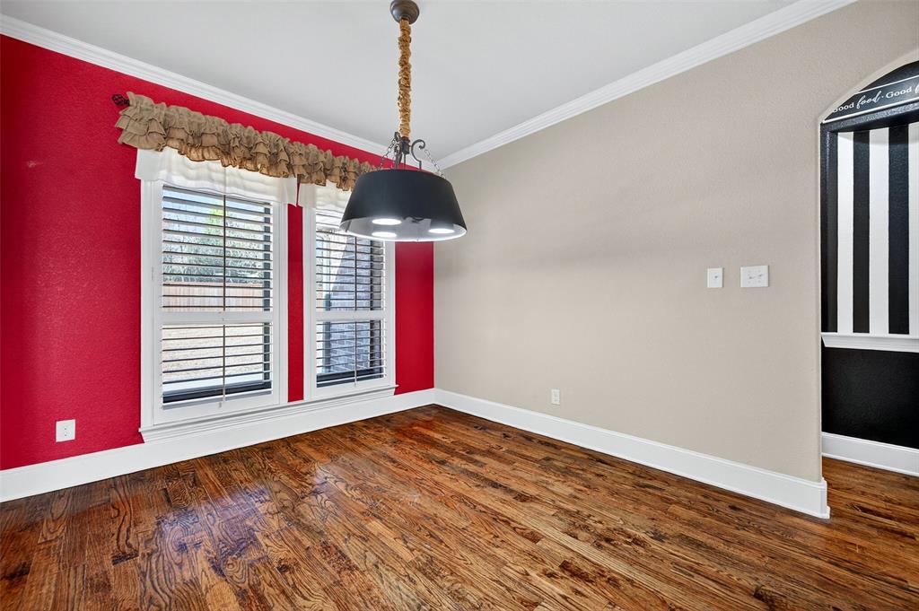 2420 Remuda Drive Sherman, TX 75092 - Photo 12 of 40 a view of an empty room with a window and wooden floor