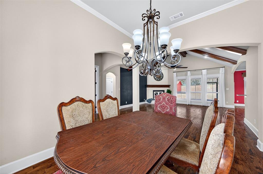 2420 Remuda Drive Sherman, TX 75092 - Photo 13 of 40 a view of a dining room with furniture and a chandelier