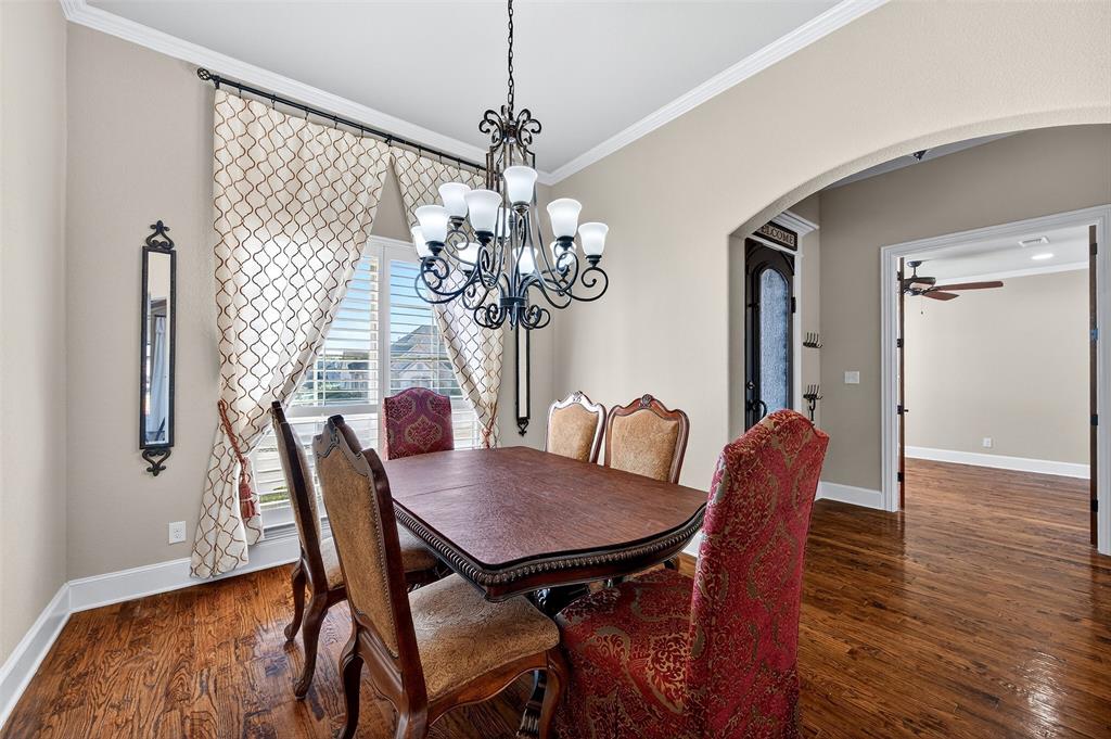 2420 Remuda Drive Sherman, TX 75092 - Photo 14 of 40 a view of a dining room with furniture wooden floor and chandelier