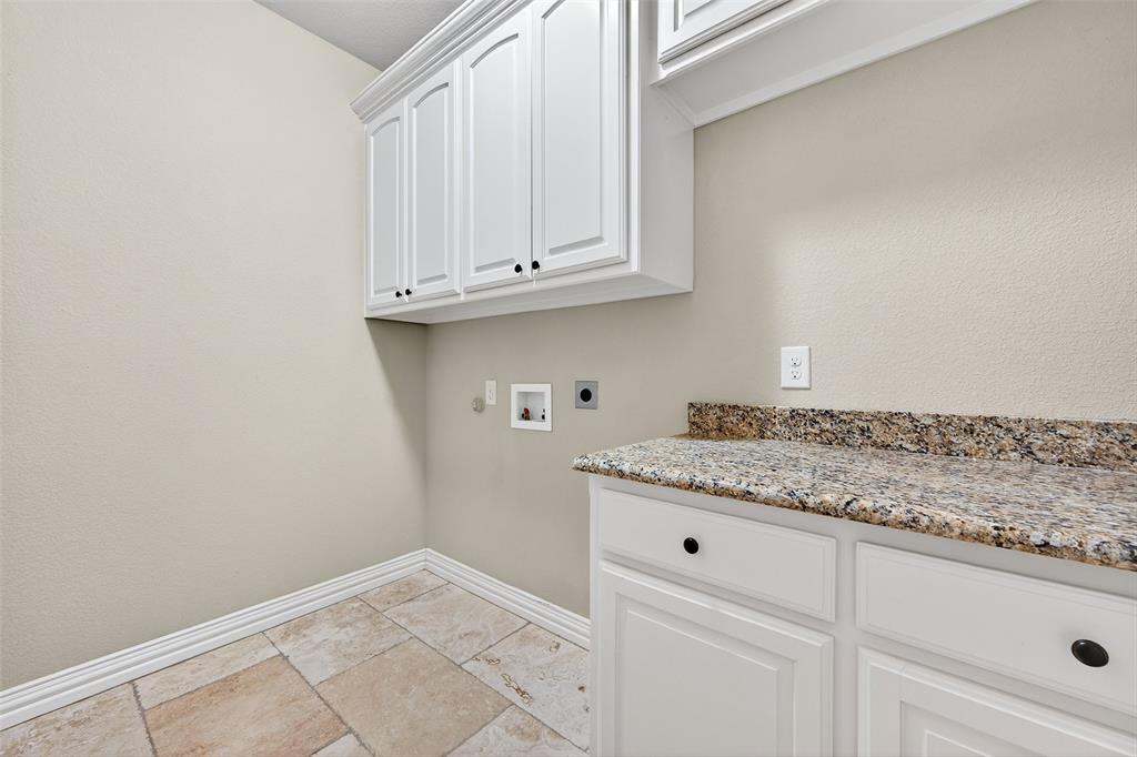2420 Remuda Drive Sherman, TX 75092 - Photo 15 of 40 a kitchen with granite countertop white cabinets and a sink