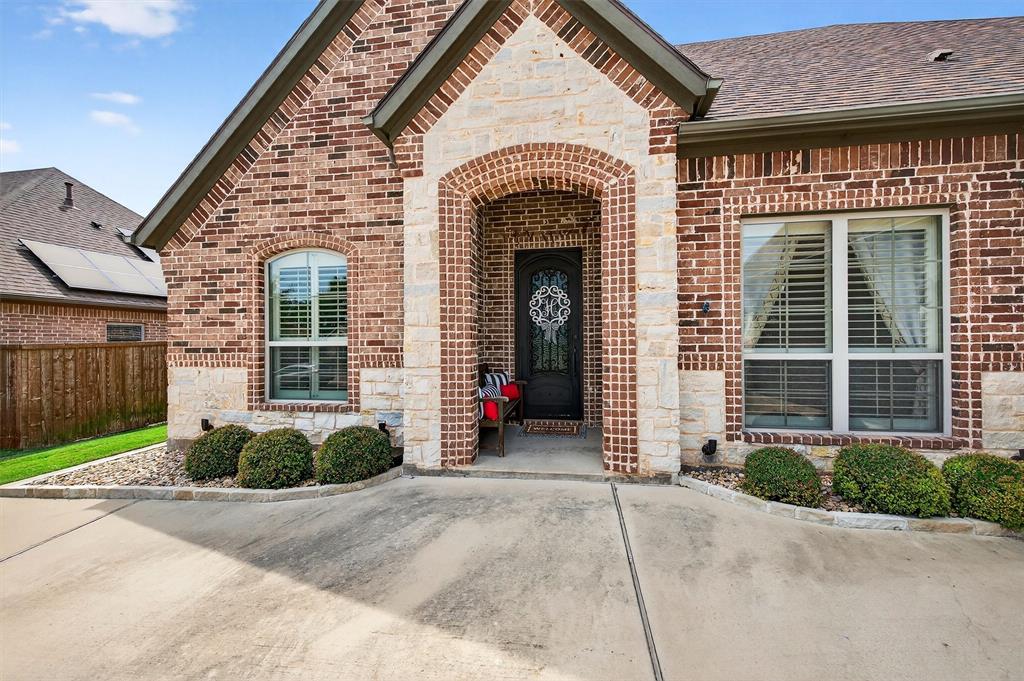 2420 Remuda Drive Sherman, TX 75092 - Photo 3 of 40 a front view of a house with a yard and garage