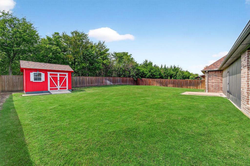 2420 Remuda Drive Sherman, TX 75092 - Photo 37 of 40 a sign that is sitting in the grass near a house