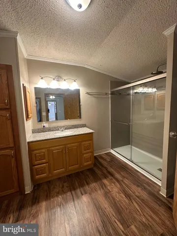 a bathroom with a sink mirror and a bath tub