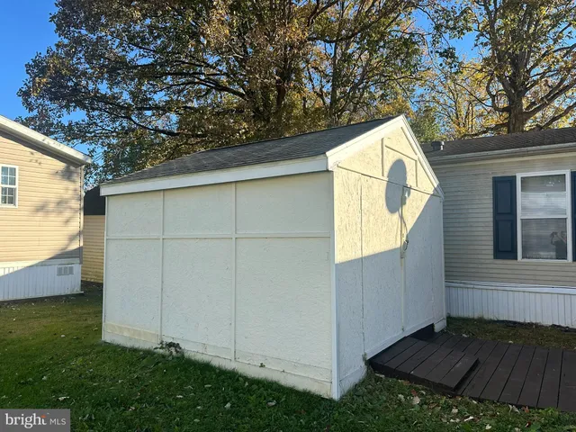 a view of backyard with cabin