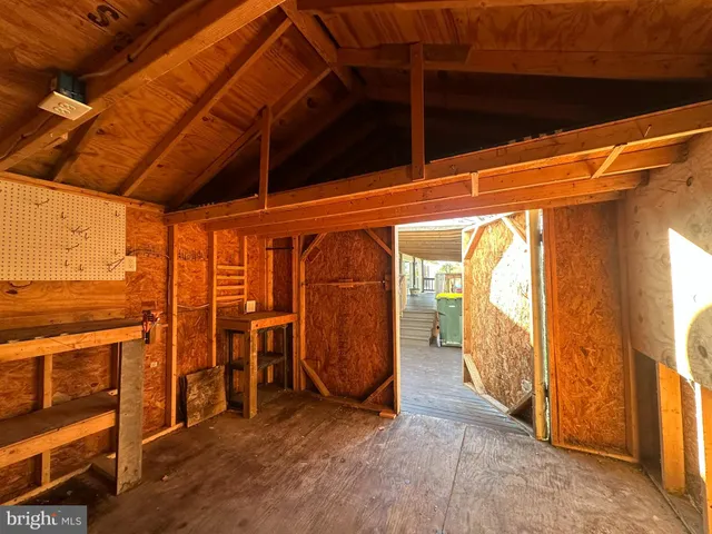 a view of a room with wooden walls