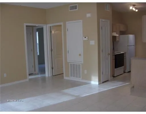 a view of a kitchen with a refrigerator a sink and dishwasher oven
