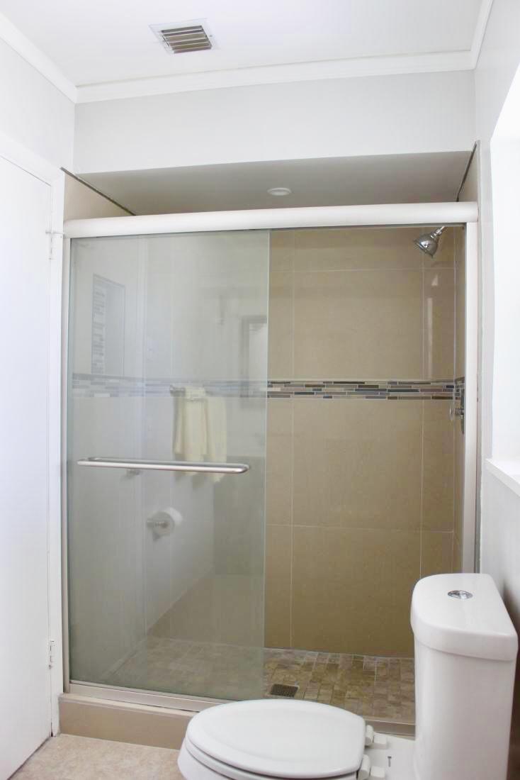 846 Northwest 7th Street Boca Raton, FL 33486 - Photo 17 of 19 a bathroom with a toilet and a shower