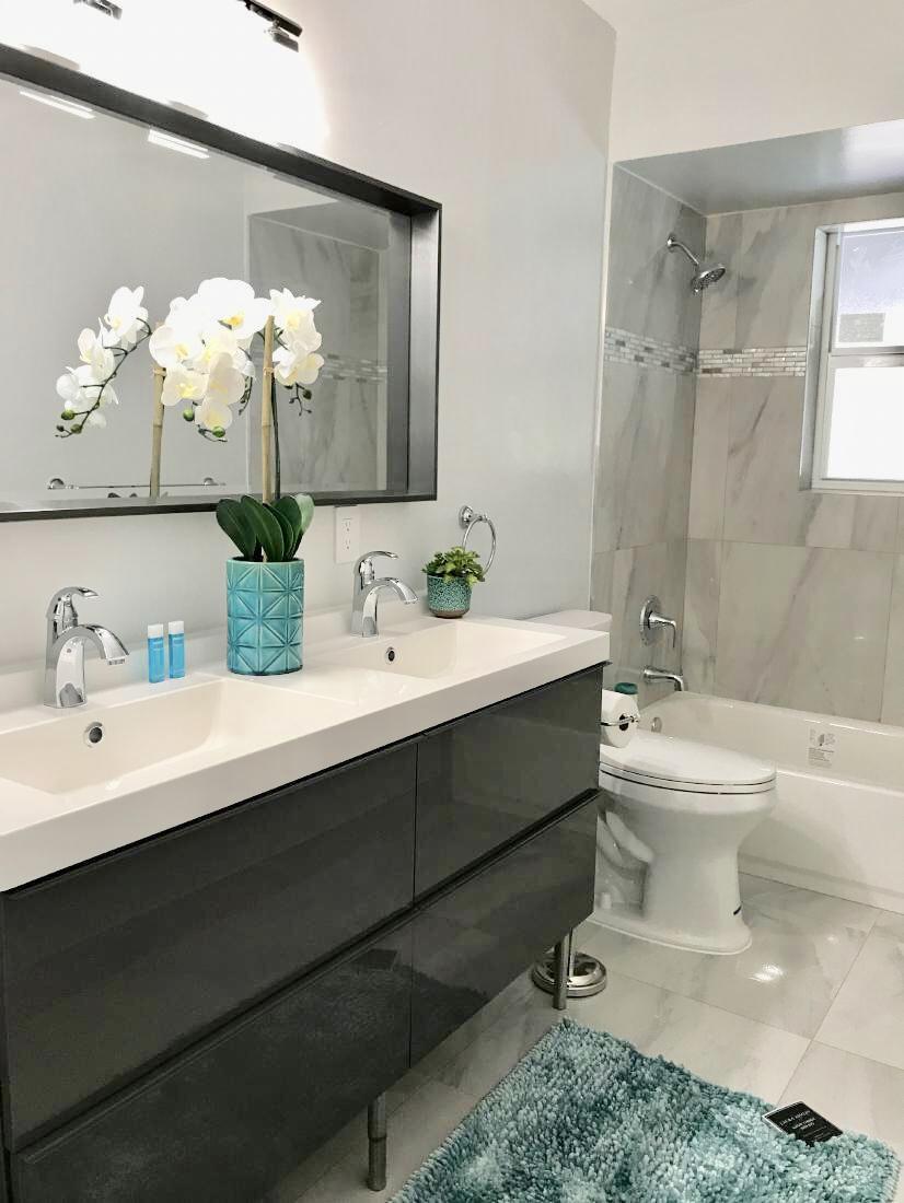 846 Northwest 7th Street Boca Raton, FL 33486 - Photo 18 of 19 a bathroom with a sink toilet and shower