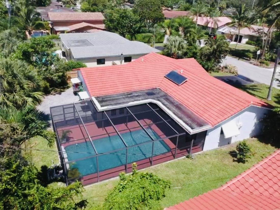 846 Northwest 7th Street Boca Raton, FL 33486 - Photo 2 of 19 an aerial view of a house with a garden