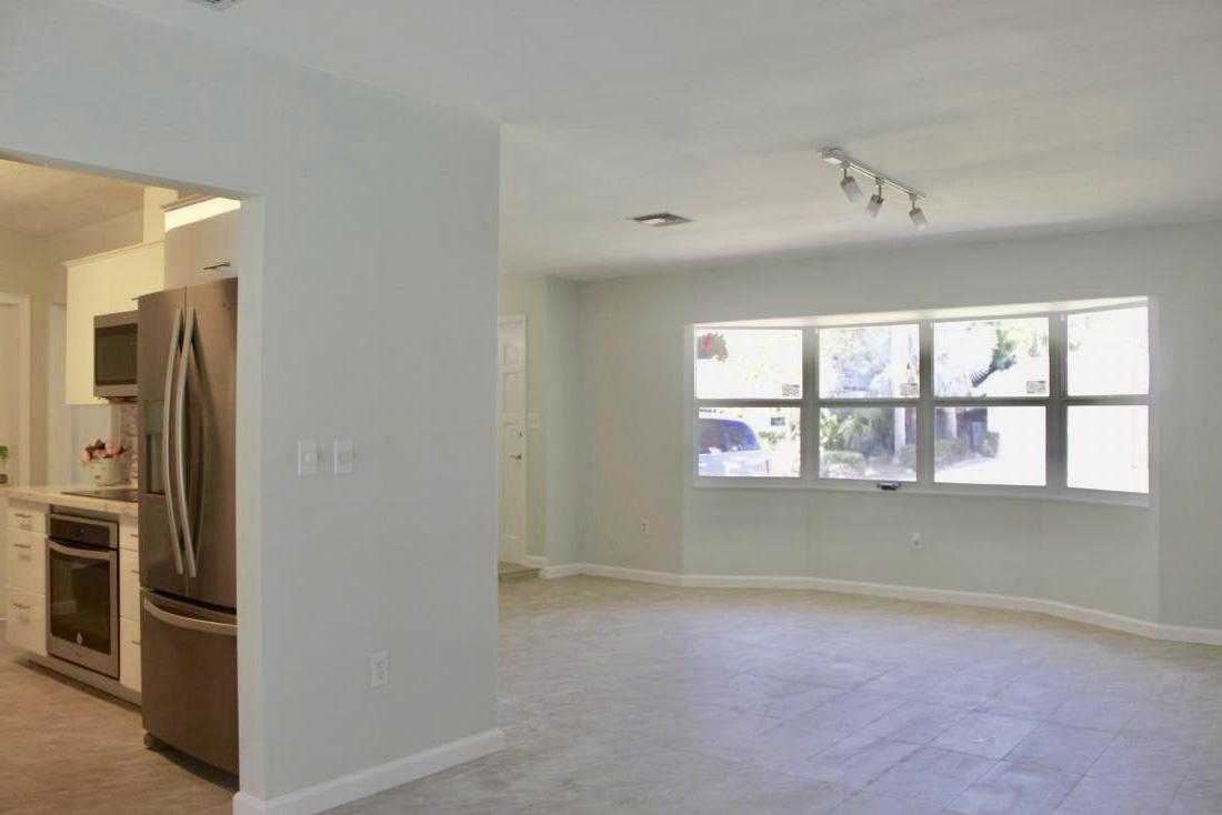 846 Northwest 7th Street Boca Raton, FL 33486 - Photo 8 of 19 an empty room with windows and refrigerator