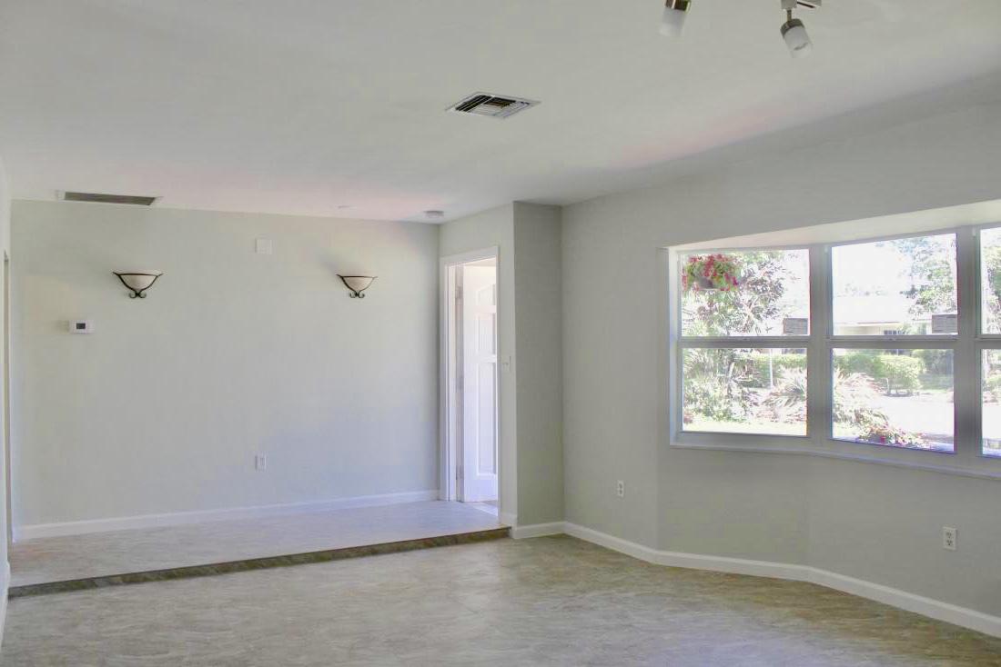 846 Northwest 7th Street Boca Raton, FL 33486 - Photo 9 of 19 a view of an empty room with a window