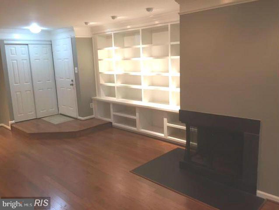 5800 Cove Landing Road, Unit 303 Burke, VA 22015 - Photo 5 of 25 living room, fp, built ins, recessed lighting