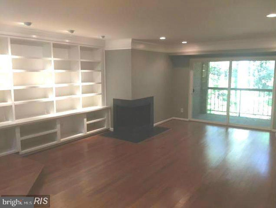 5800 Cove Landing Road, Unit 303 Burke, VA 22015 - Photo 8 of 25 built in book shelves, fp, open
