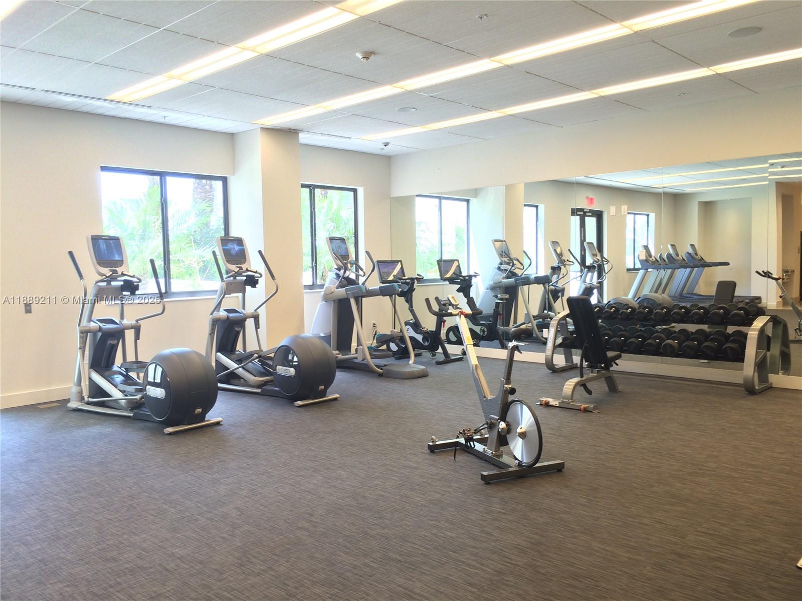 999 Southwest 1st Avenue, Unit 2103 Miami, FL 33130 - Photo 11 of 16 a view of a room with gym equipment