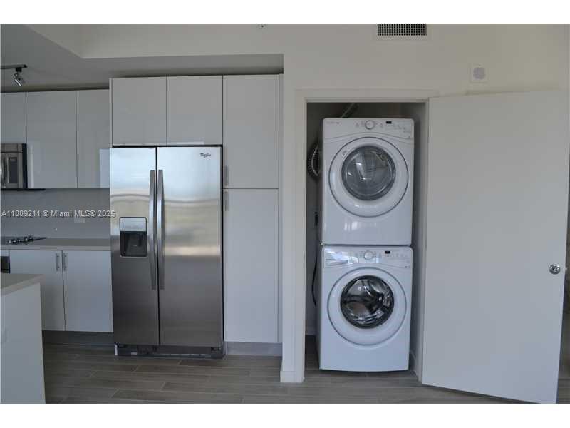 999 Southwest 1st Avenue, Unit 2103 Miami, FL 33130 - Photo 7 of 16 a utility room with sink dryer and washer
