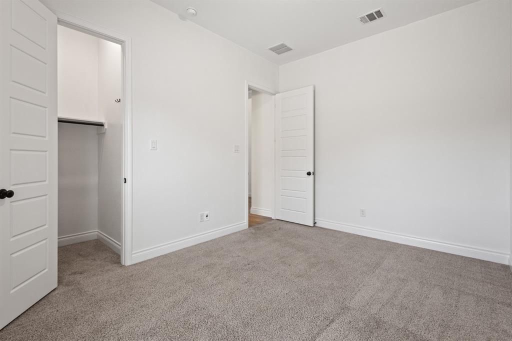 960 Knoxbridge Road Forney, TX 75126 - Photo 9 of 22 Bedroom featuring neutral-toned carpeting, white walls, and white trim