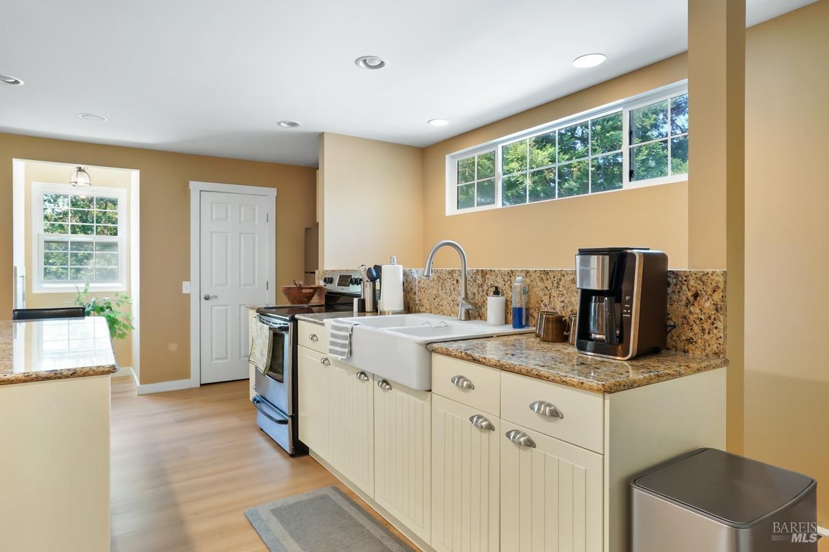 1846 Indian Valley Road, Unit A Novato, CA 94947 - Photo 27 of 45 a kitchen with a sink stove and refrigerator