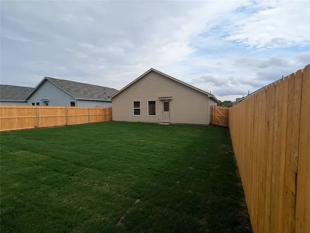 a backyard of a house with lots of green space
