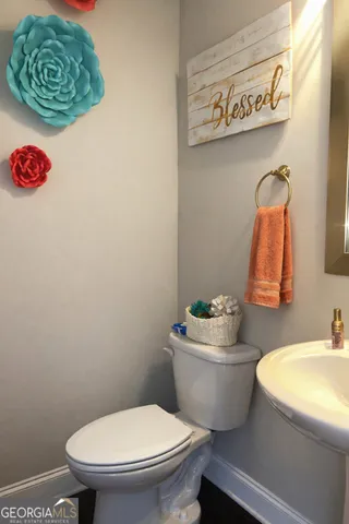 a bathroom with a toilet and a sink