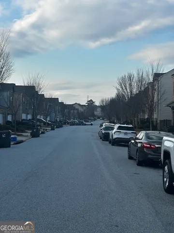 a view of street with parked cars