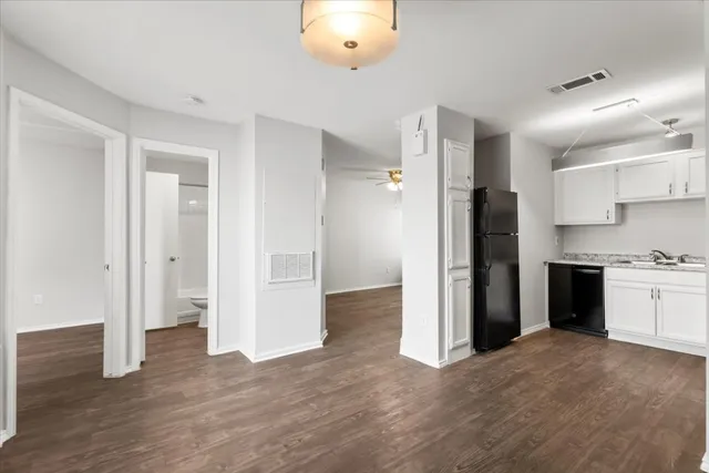 a view of a kitchen with a refrigerator and a stove