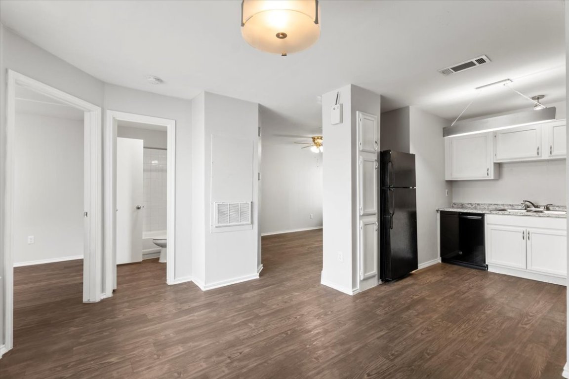 1740 Timber Ridge Road, Unit 132 Austin, TX 78741 - Photo 12 of 29 a view of a kitchen with a refrigerator and a stove